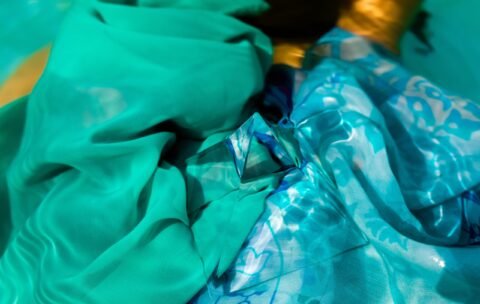 cropped-image-woman-holding-prism-swimming-pool-min