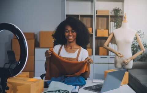 fashion-blogger-concept-young-asian-women-selling-clothes-video-streamingstartup-small-business-sme-using-smartphone-tablet-taking-receive-checking-office-min