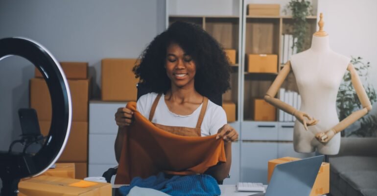 fashion-blogger-concept-young-asian-women-selling-clothes-video-streamingstartup-small-business-sme-using-smartphone-tablet-taking-receive-checking-office-min